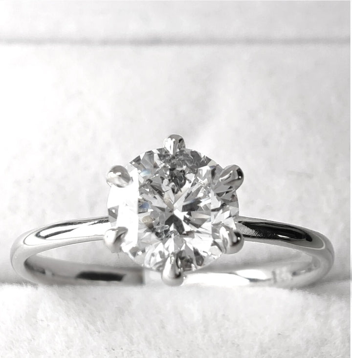 Studio image of 0.90ct E-F color, I1 clarity diamond ring in 18k white gold, handcrafted six-prong setting
