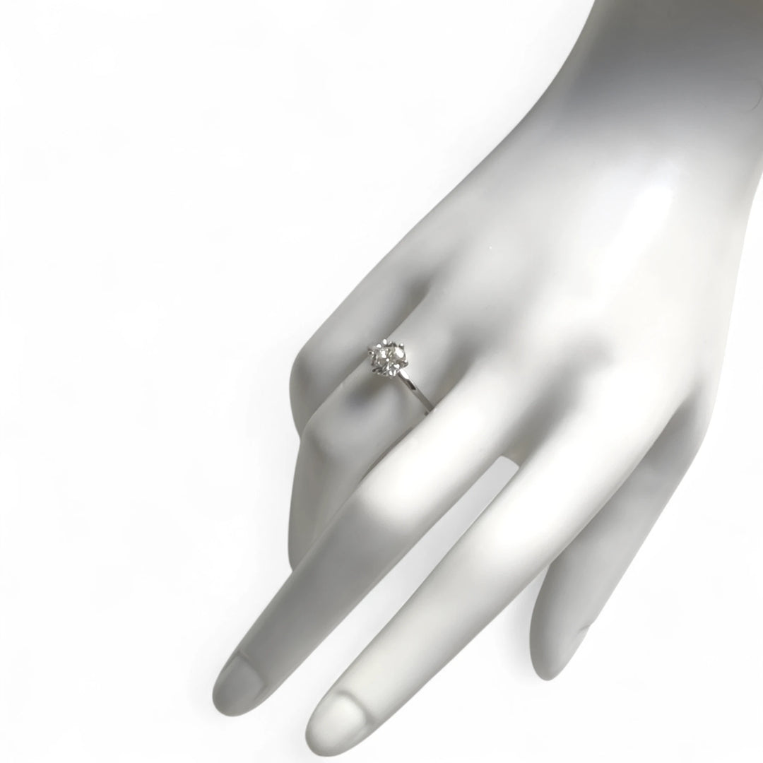 Ring worn on mannequin hand, showcasing diamond size and ring scale