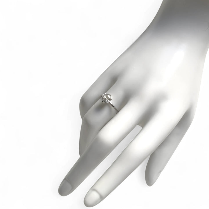 Ring worn on mannequin hand, showcasing diamond size and ring scale