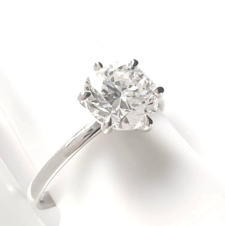 Detailed side-angle showing diamond brilliance and six-prong setting