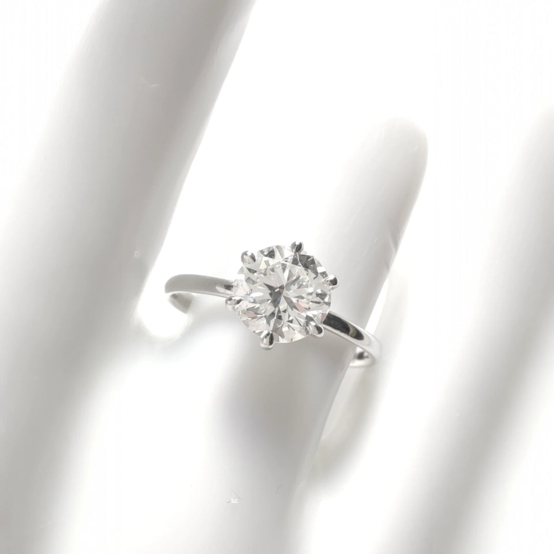 Frontal view of diamond ring worn on hand, ideal for sizing perspective