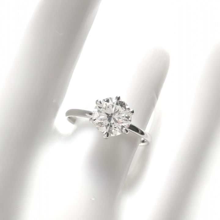 Frontal view of diamond ring worn on hand, ideal for sizing perspective
