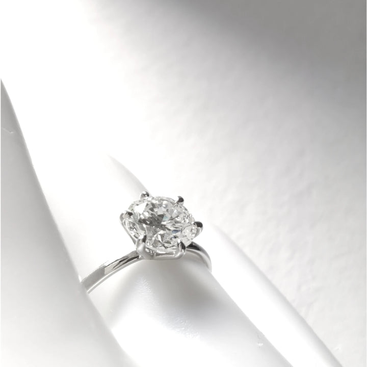 Diagonal artistic shot highlighting the sparkle and elevation of the diamond