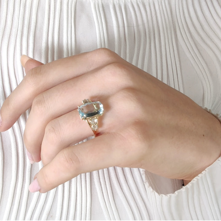 Stunning aquamarine and diamond ring in 14K yellow gold, modeled for a luxurious look