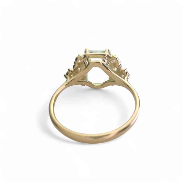 An aquamarine engagement ring in 18K gold displayed inside a jewelry box, featuring diamonds, part of the aquamarine collection, ideal for special occasions