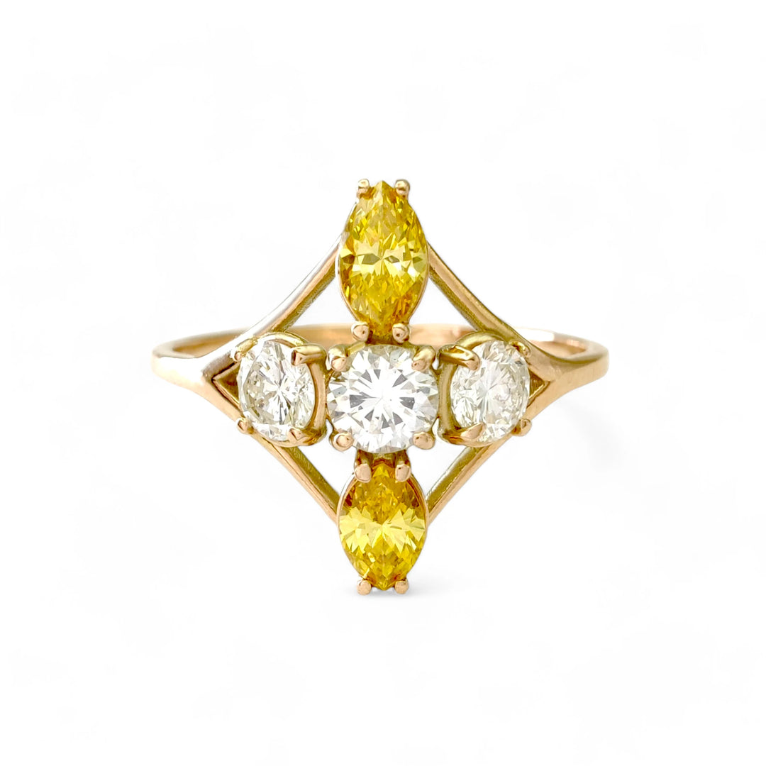 Front view of a 14K yellow gold engagement ring with a cross design of diamonds, showcasing a mix of brilliant and fancy yellow marquise diamonds, ideal for buyers looking for a unique ring.