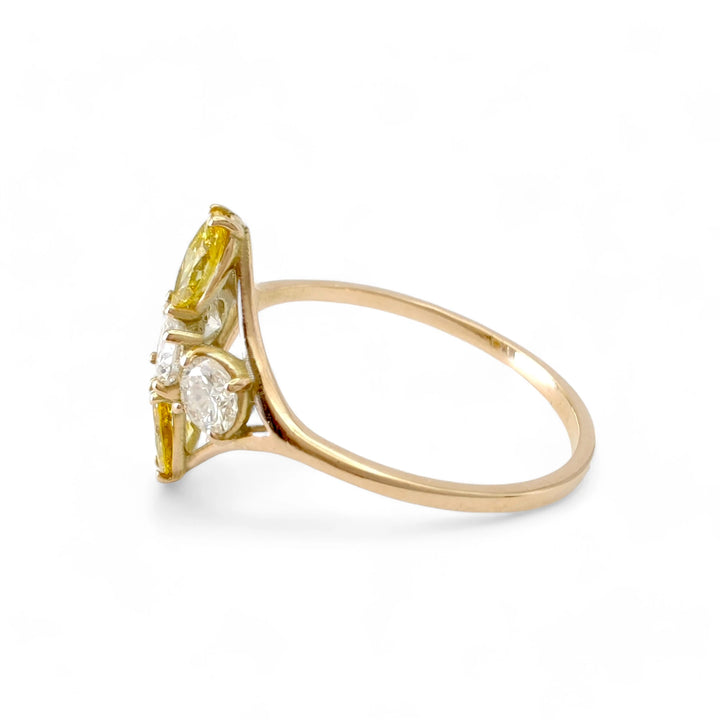 Left side view of a 14K yellow gold engagement ring with a cross pattern of diamonds, showcasing the setting and craftsmanship of the brilliant and marquise diamonds