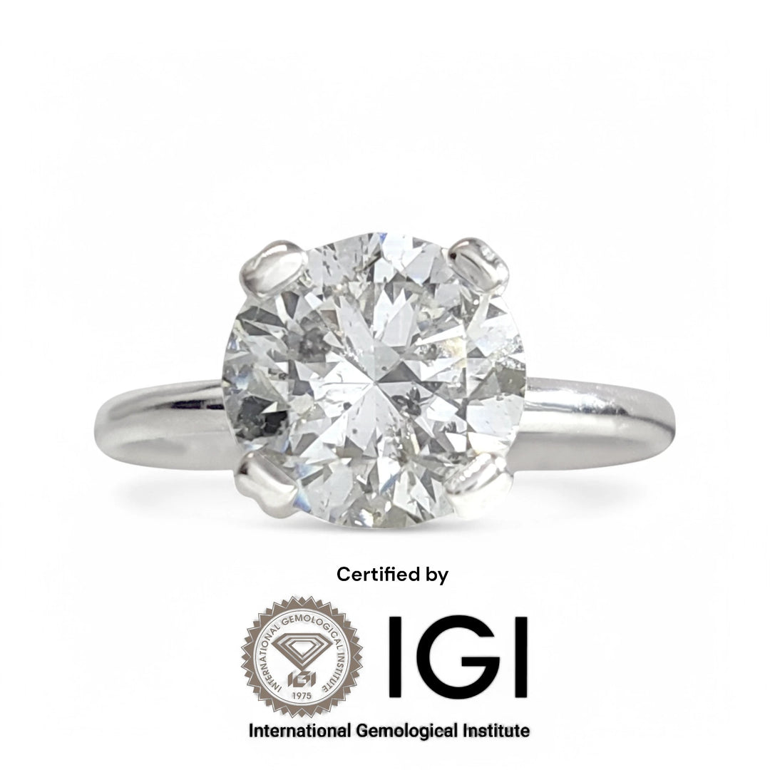 Front view of solitaire engagement ring with IGI certification tag included