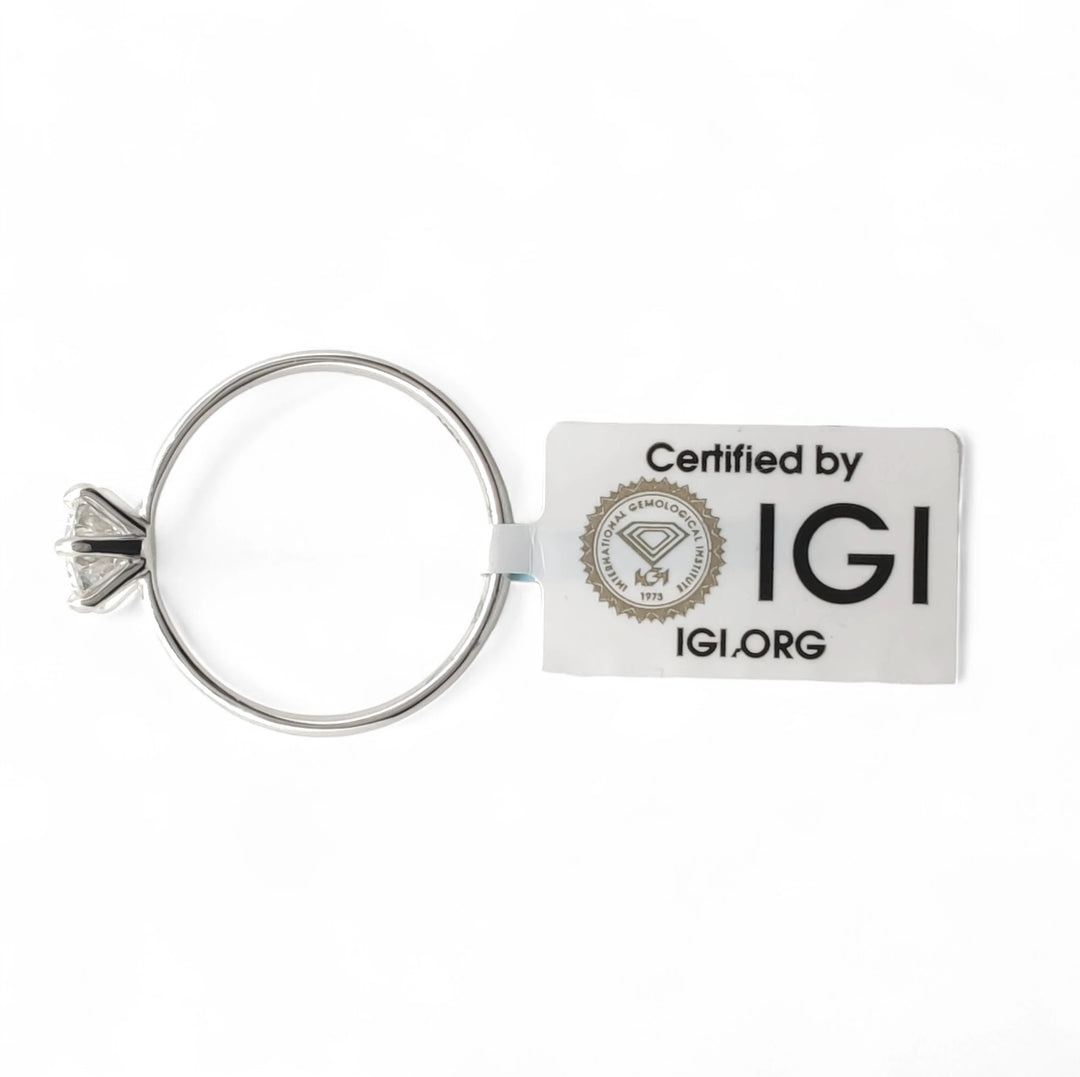 Portable 18K white gold diamond engagement ring attached to a silver keychain, accompanied by an official IGI certification tag (Certified by IGI)