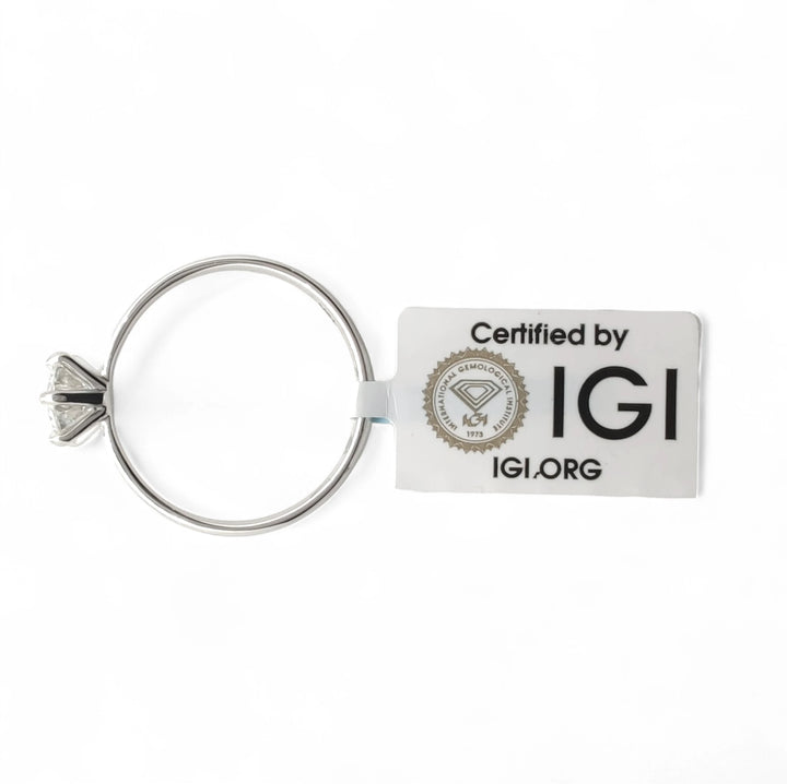 Portable 18K white gold diamond engagement ring attached to a silver keychain, accompanied by an official IGI certification tag (Certified by IGI)