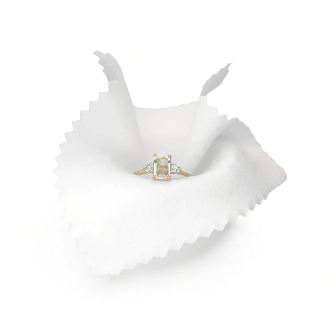 Educational image illustrating "The Ultimate Guide to Caring for and Maintaining Your Gold Ring with Gemstones," featuring tips on proper care and maintenance for engagement rings to ensure longevity and brilliance