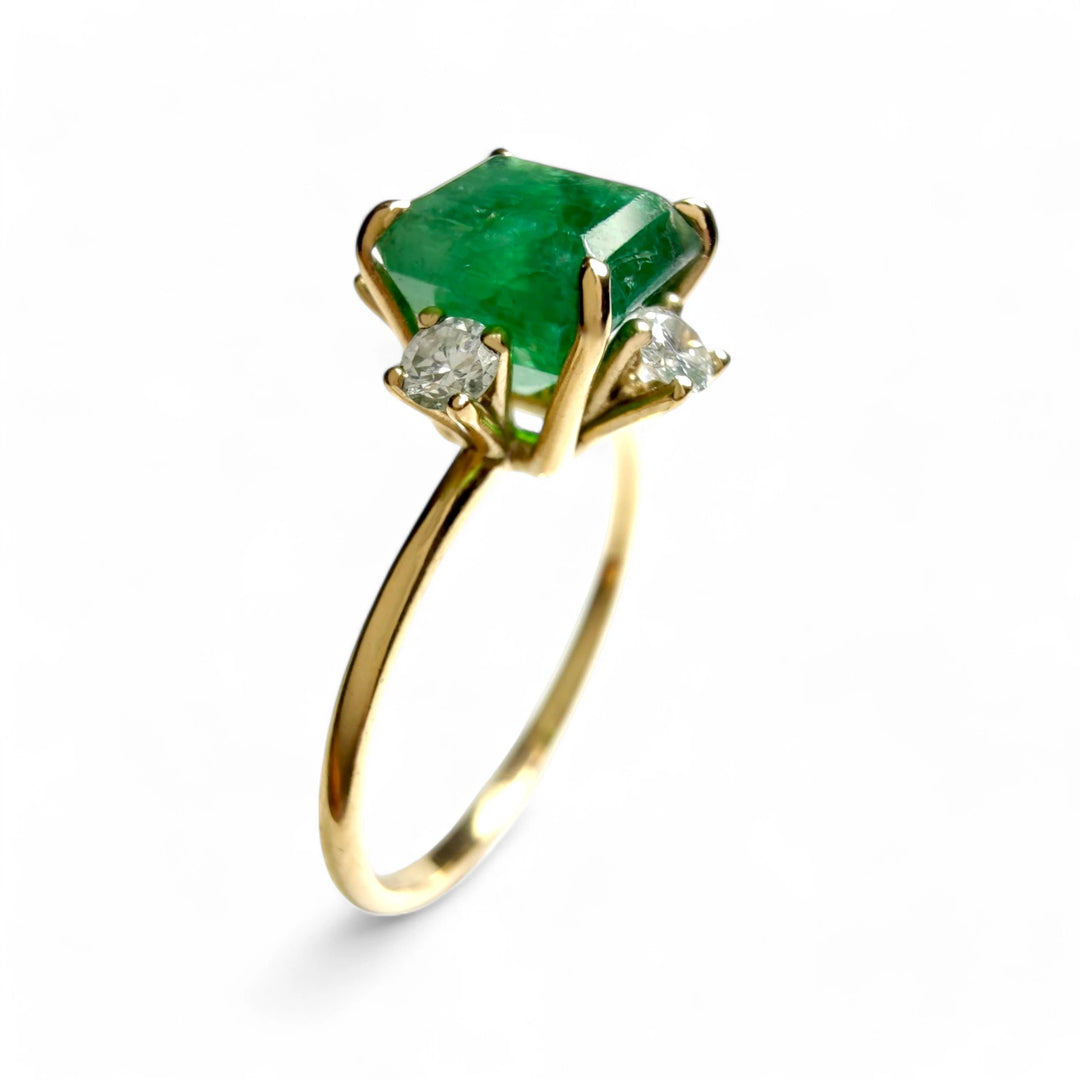 Vertical view of the 18K gold octagon emerald engagement ring with diamonds, ideal for Christmas or as a meaningful gift.