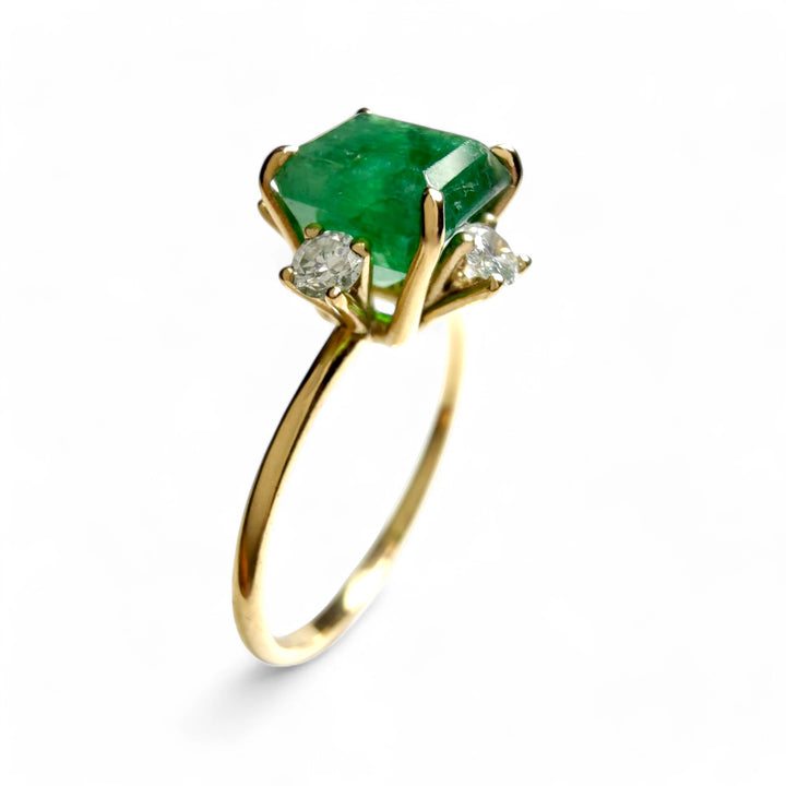 Vertical view of the 18K gold octagon emerald engagement ring with diamonds, ideal for Christmas or as a meaningful gift.