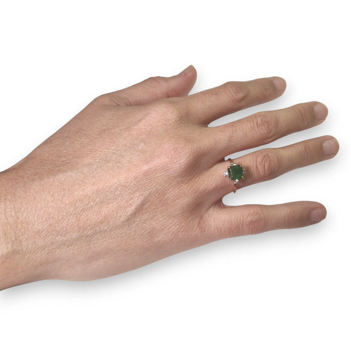 18K gold octagon emerald engagement ring worn on the model’s hand, showcasing its elegant design for Christmas or engagements