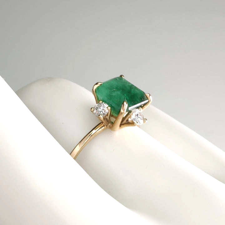 Side view of the 18K gold octagon emerald engagement ring with diamonds, a timeless gift for Christmas or engagements