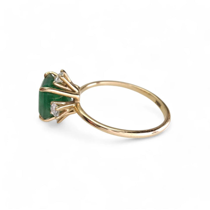 Left-side view of the 18K gold octagon emerald engagement ring, a unique Christmas or engagement gift