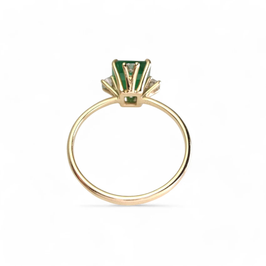 Rear view of the 18K gold octagon emerald engagement ring, showcasing its craftsmanship and holiday elegance