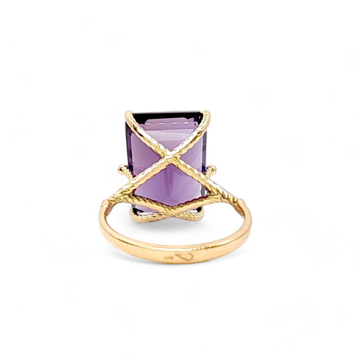 Back view of a unique 14K yellow gold ring with a striking amethyst centerpiece in a sculptural, handmade design