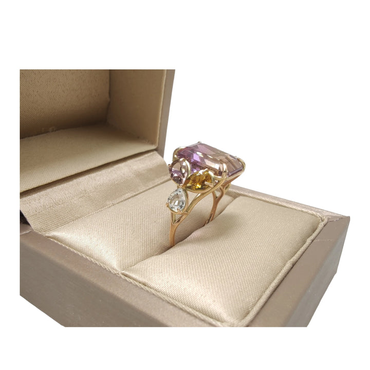 Unique 14K yellow gold cocktail ring with a central ametrine, amethysts, and aquamarines, elegantly displayed in an open jewelry gift box, black friday