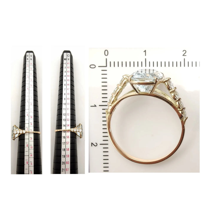 Measurement scale and size chart for a unique 14K yellow gold ring featuring a cushion-cut aquamarine and tapered diamond detailing, perfect for Christmas gifts