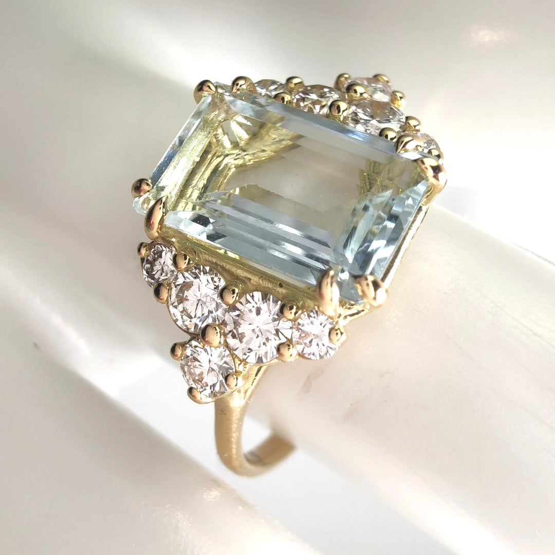 Close-up of an aquamarine engagement ring in 18K gold with diamonds, showcasing exquisite craftsmanship, part of the aquamarine collection