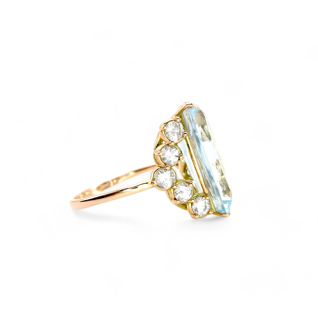 Right side view of a unique 14K yellow gold engagement ring with a cushion aquamarine and diamond detailing, ideal for Christmas gifts