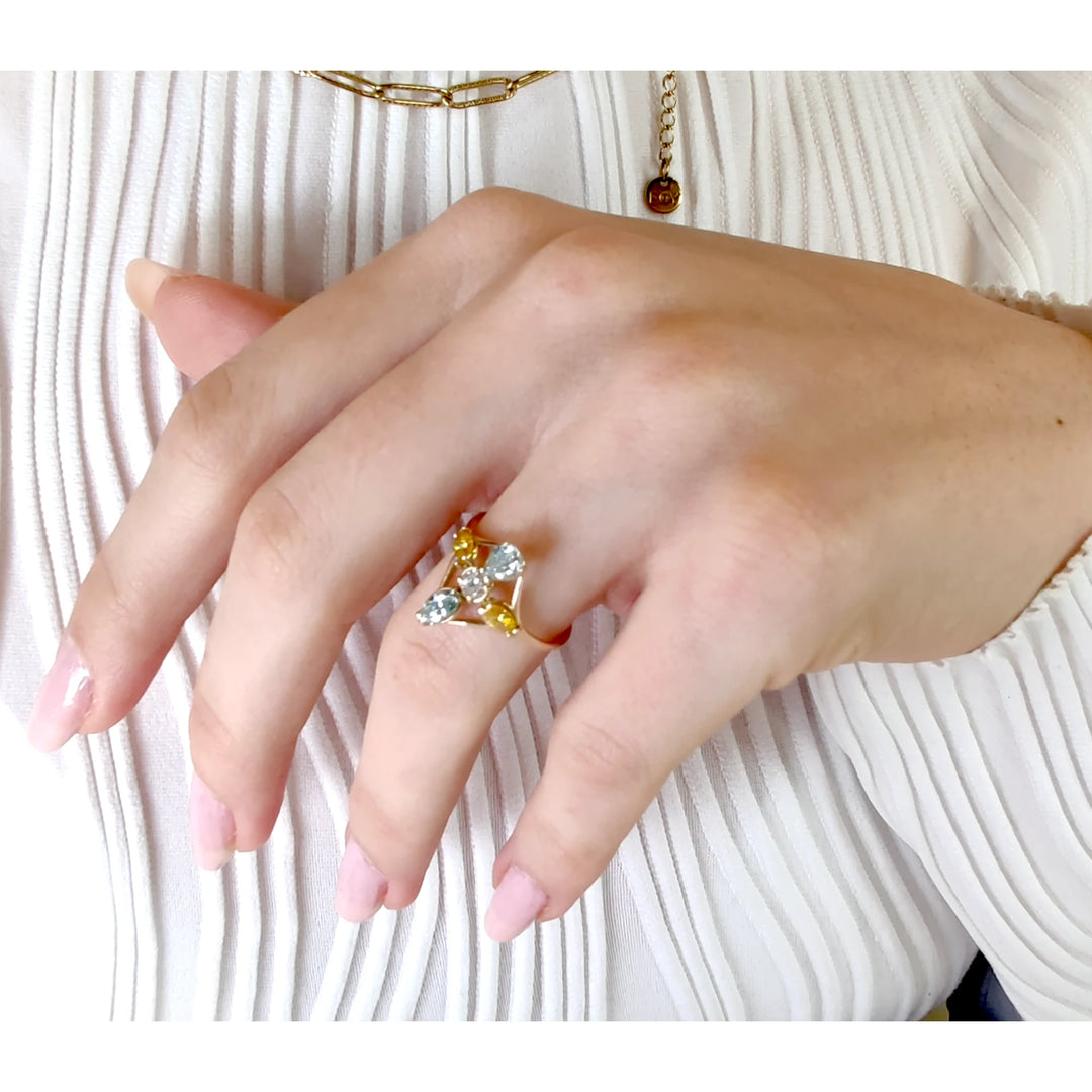 Third pose of a model wearing a 14K yellow gold engagement ring featuring a unique cross pattern of diamonds, highlighting its elegance and unique design