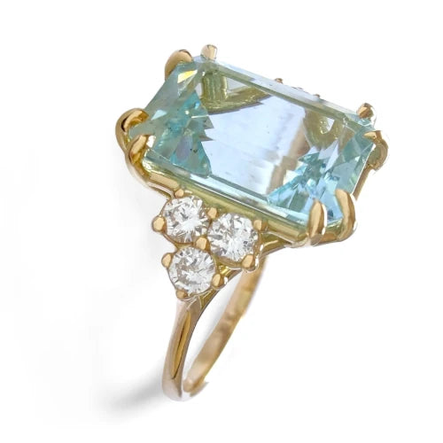 Vertical frontal side view of a contemporary 18K solid yellow gold engagement ring featuring a large emerald-cut aquamarine with three diamonds on each side in a cathedral style, ideal for a Christmas gift or special occasion.