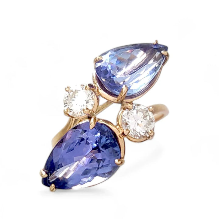 Front view of a 14K yellow gold 'Toi et Moi' (You and Me) style engagement ring, featuring pear-cut tanzanite and two brilliant diamonds, perfect for Christmas or as a special engagement gift