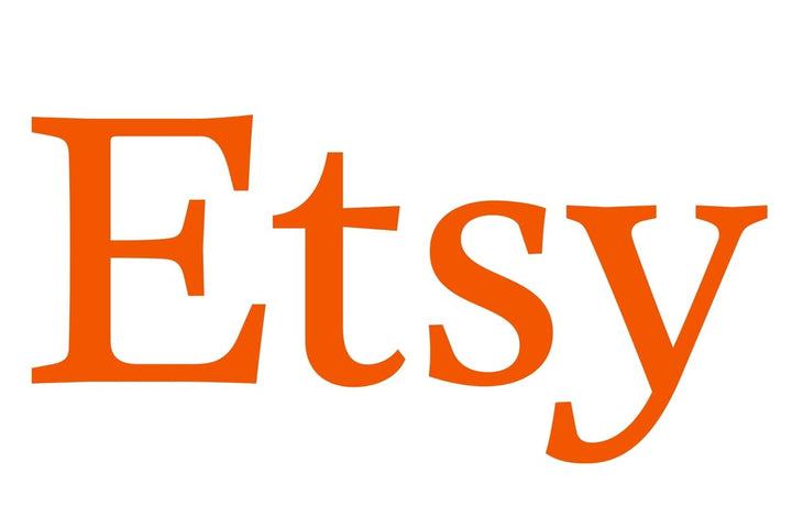 Logo of Etsy, an online platform for buying gold rings with precious stones, including engagement rings, showcasing handmade and unique jewelry designs