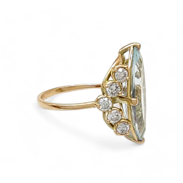 Right side view of a handmade 14K yellow gold engagement ring with a marquise-cut diamond and diamond accents, perfect for a modern and timeless look.