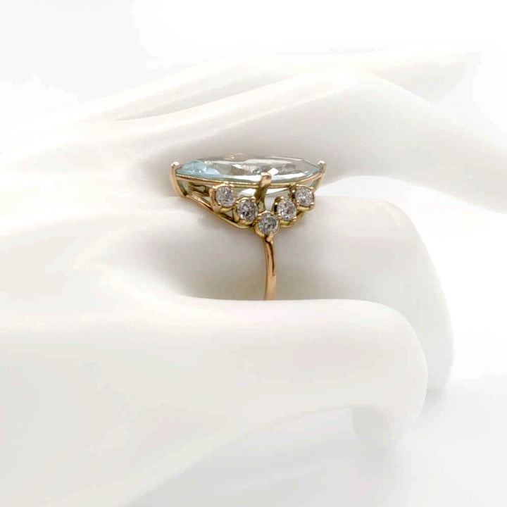 Right side view of a handmade 14K yellow gold engagement ring with a marquise-cut diamond and diamond accents, perfect for a modern and timeless look