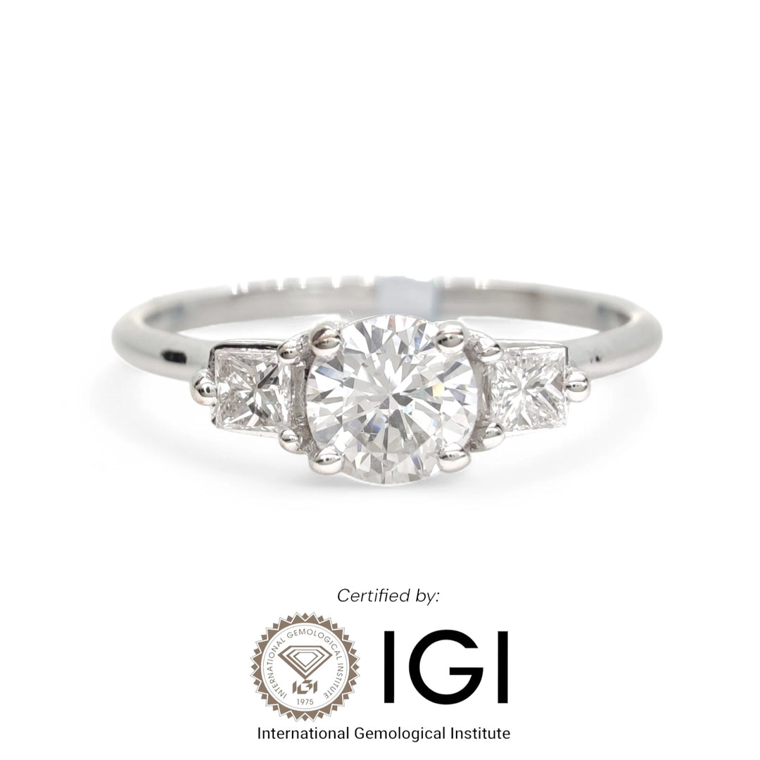 Luxurious white gold engagement ring featuring a stunning round-cut diamond center stone, certified by the International Gemological Institute (IGI). This elegant piece combines beauty and authenticity