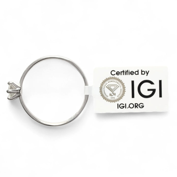 IGI certified diamond solitaire ring with official certification tag