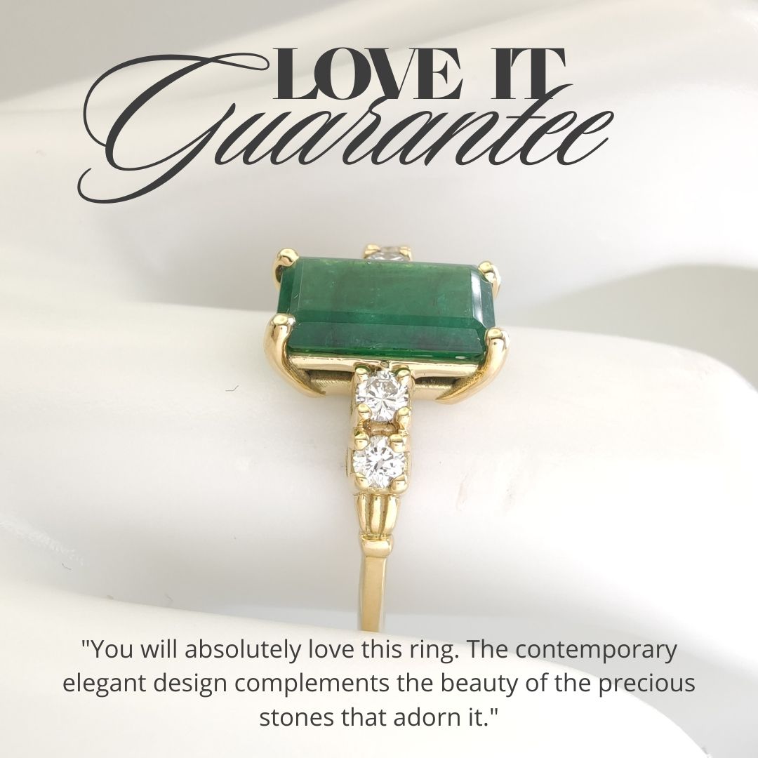 Vintage-inspired emerald engagement ring in 18K yellow gold with diamonds, displayed on a mannequin hand, perfect for Christmas gifts

