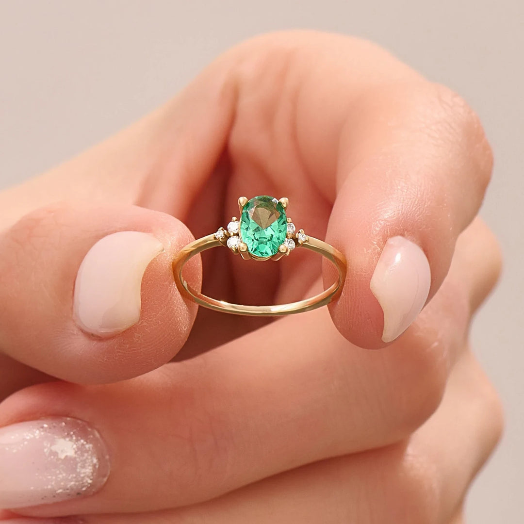 18k yellow gold engagement ring with emerald and diamond