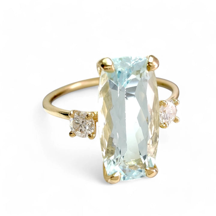 ngagement ring in 18K gold with aquamarine and diamonds, cover photo showcasing elegant and detailed craftsmanship