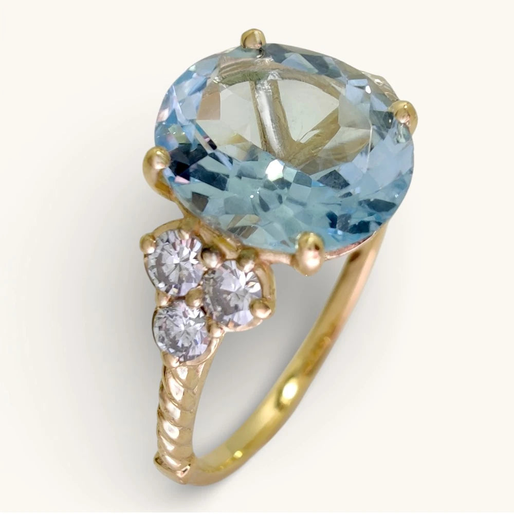 2.98 ct oval blue topaz diamond ring in 18k yellow gold with sculptural twisted band