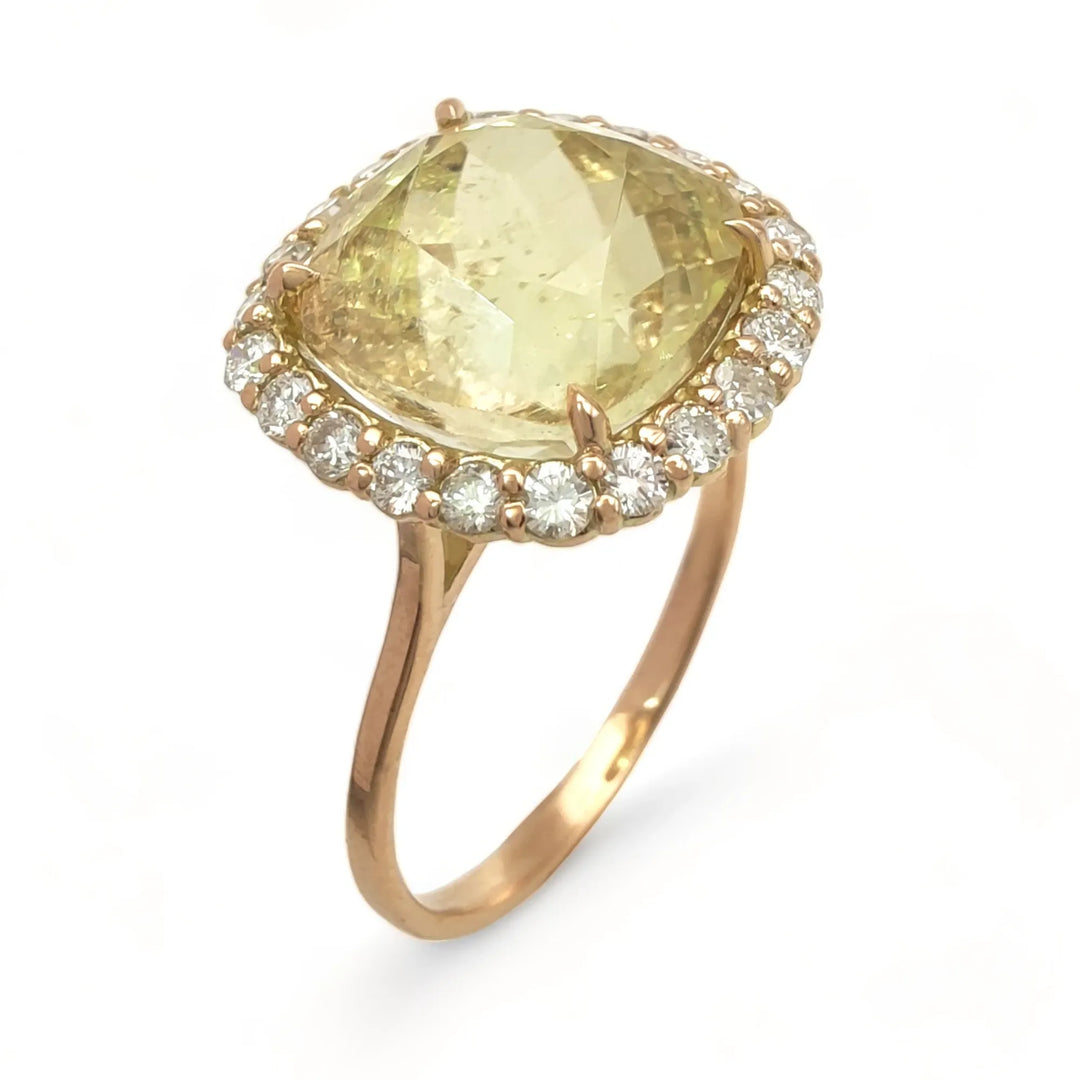 Vertical perspective view of a handcrafted 14K yellow gold women’s ring with a yellow Tourmaline centerpiece and a brilliant cut diamond halo